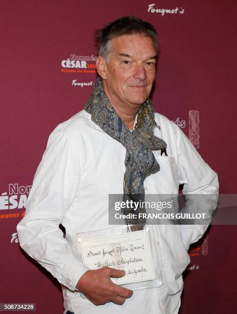 French director Benoit Jacquot poses with his nomination certificate for Best Adaptation during the nominations event for the 2016 César film awards,...