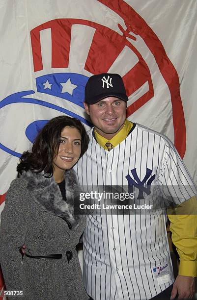 Jason Giambi poses with his fiancee Kristian Rice after signing a seven-year $120 Million deal with the New York Yankees at Yankee Stadium in New...