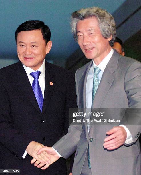 Thai Prime Minister Thaksin Shinawatra and Japanese Prime Minister Junichiro Koizumi shake hands prior to their meeting at Koizumi's official...