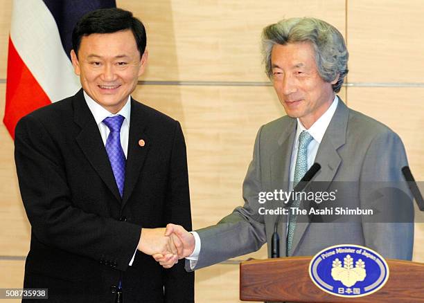 Thai Prime Minister Thaksin Shinawatra and Japanese Prime Minister Junichiro Koizumi shake hands during a press conference after their meeting at...