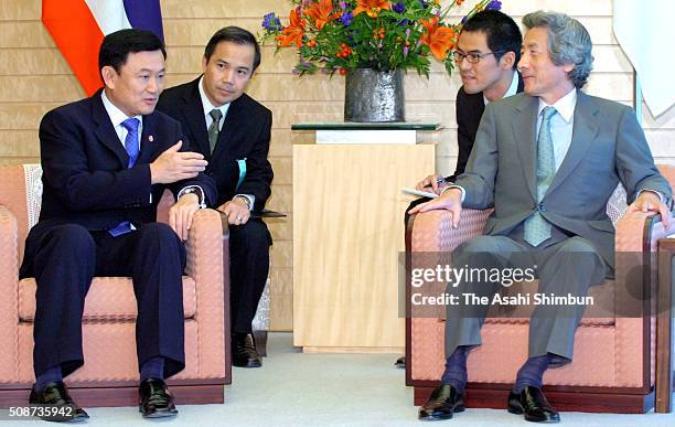 Thai Prime Minister Thaksin Shinawatra and Japanese Prime Minister Junichiro Koizumi takl during their meeting at Koizumi's official residence on...