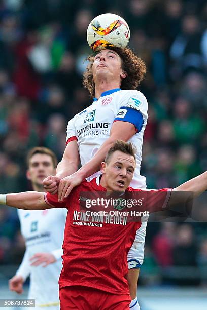 Uffe Bech of Hannover and Julian Baumgartlinger of Mainz compete for the ball during the first Bundesliga match between Hannover 96 and 1. FSV Mainz...