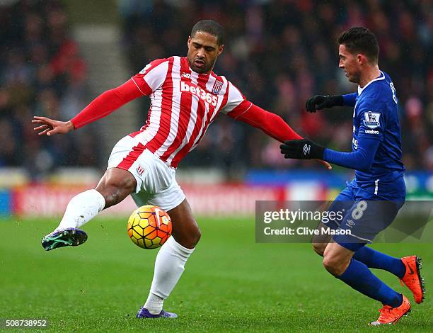 Glen Johnson of Stoke City and Bryan Oviedo of Everton compete for the ball during the Barclays Premier League match between Stoke City and Everton...