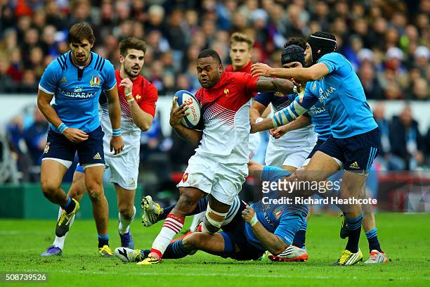 Virimi Vakatawa of France breaks free from a tackle by Gonzalo Garcia of Italy during the RBS Six Nations match between France and Italy at Stade de...