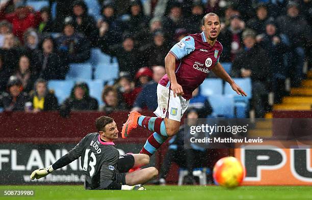 Gabriel Agbonlahor of Aston Villa scores his team's second goal past Declan Rudd of Norwich City during the Barclays Premier League match between...