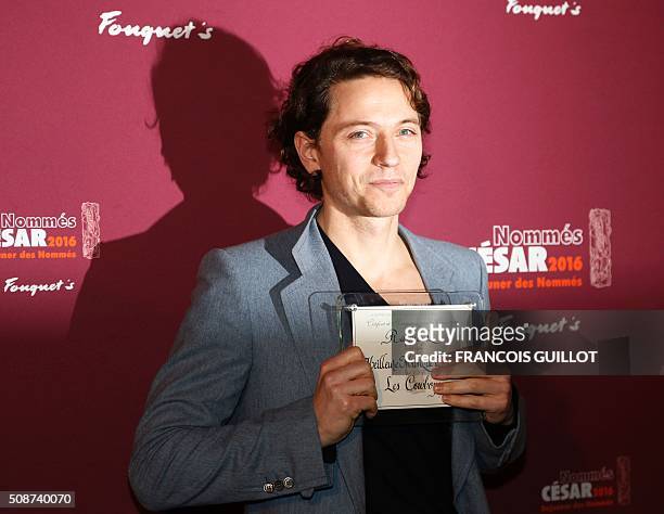 French singer Raphael poses with his nomination certificate for Best Original Music during the nominations event for the 2016 César film awards, on...