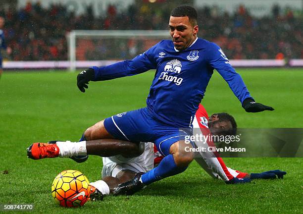 Aaron Lennon of Everton is tackled by Mame Biram Diouf of Stoke City during the Barclays Premier League match between Stoke City and Everton at...