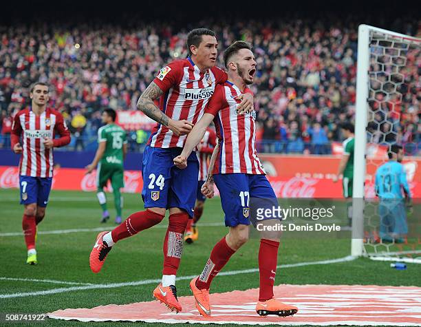 Saul Niguez of Club Atletico de Madrid celebrates with Jose Maria Gimenez after scoring his team's 2nd goal during the La Liga match between Club...