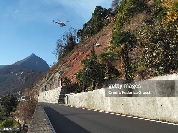 helicopter and men at work after major landslide - landslide stock pictures, royalty-free photos & images