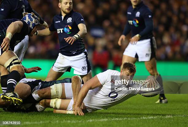 Lock George Kruis of England crashes over to score the opening try during the RBS Six Nations match between Scotland and England at Murrayfield...
