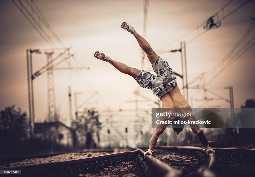 Calisthenics on railroad tracks.