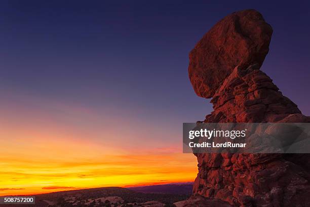 sunset at the balanced rock - balanced rock arches national park stock pictures, royalty-free photos & images