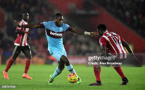 Michail Antonio of West Ham United is faced by Victor Wanyama of Southampton during the Barclays Premier League match between Southampton and West...