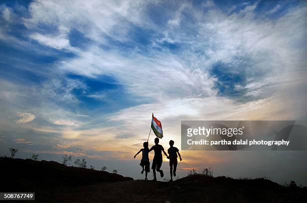 boys running with indian flag - indian flag stock pictures, royalty-free photos & images