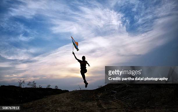 boy running with indian flag - bengali flag stock pictures, royalty-free photos & images