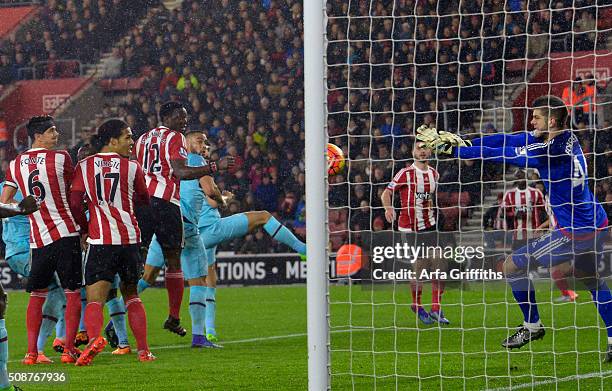 Fraser Forster of Southampton saves from Winston Reid of West Ham United during the Barclays Premier League match between Southampton and West Ham...