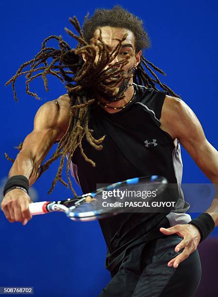 Germany's Dustin Brown returns the ball to France's Richard Gasquet during their semi-final tennis match at the Open Sud de France ATP World Tour in...