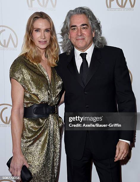 Actress Kelly Lynch and producer Mitch Glazer arrive at the 27th Annual Producers Guild Awards at the Hyatt Regency Century Plaza on January 23, 2016...