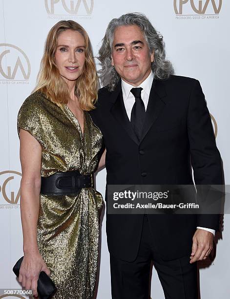 Actress Kelly Lynch and producer Mitch Glazer arrive at the 27th Annual Producers Guild Awards at the Hyatt Regency Century Plaza on January 23, 2016...