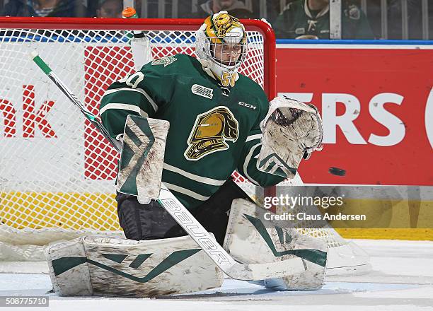 Brendan Burke of the London Knights gets set to stop a shot against the Owen Sound Attack during an OHL game at Budweiser Gardens on February 5, 2016...