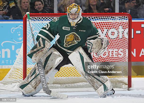 Brendan Burke of the London Knights gets set to face a shot against the Owen Sound Attack during an OHL game at Budweiser Gardens on February 5, 2016...