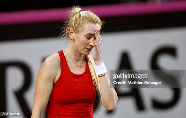 Olga Govortsova of Belarus reacts after loosing a point to Aleksandra Wozniak of Canada during their Fed Cup BNP Paribas match at Laval University in...