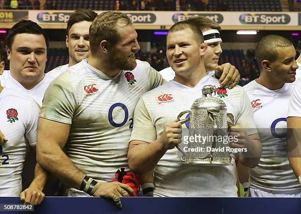England captain Dylan Hartley and James Haskell pose with the Calcutta Cup following their victory during the RBS Six Nations match between Scotland...