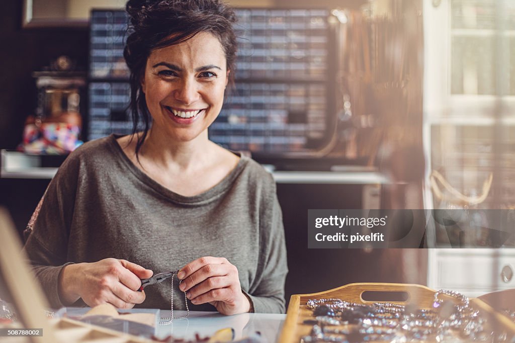 Beautiful woman jewelry maker