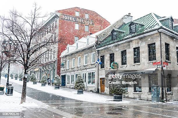 travel destination old montreal canada buildings with snow in winter - quebec road stock pictures, royalty-free photos & images