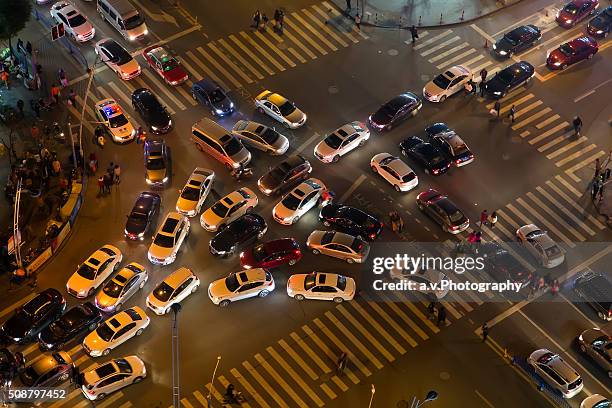 traffic jam at road intersection in shanghai. - traffic jam china stock pictures, royalty-free photos & images