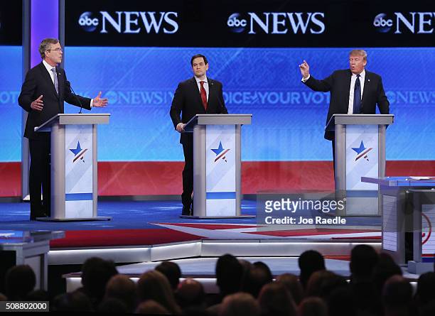 Republican presidential candidates Jeb Bush, Sen. Marco Rubio and Donald Trump participate in the Republican presidential debate at St. Anselm...