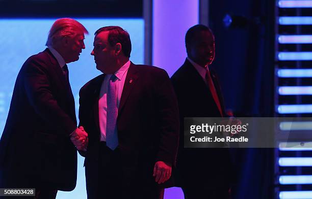 Republican presidential candidates Donald Trump, New Jersey Governor Chris Christie and Ben Carson visit during a commerical break in the Republican...