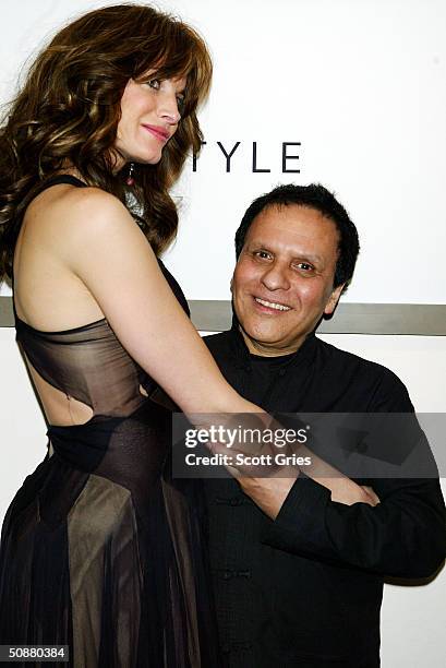 Stephanie Seymour and Azzedine Alaia pose during a gala to honor designer Alaia at the Guggenheim Museum May 20, 2004 in New York City.