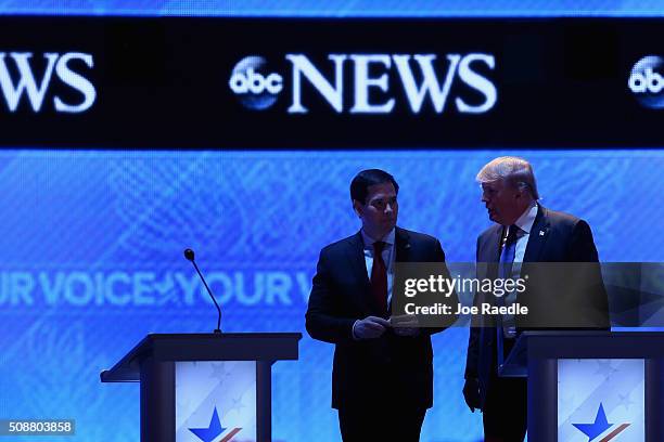 Republican presidential candidates Donald Trump and Sen. Marco Rubio visit during a commercial break in the Republican presidential debate at St....