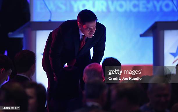 Republican presidential candidate Sen. Marco Rubio talks to audience members during a commercial break in the Republican presidential debate at St....