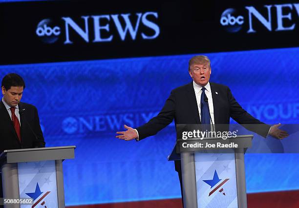 Republican presidential candidates Sen. Marco Rubio and Donald Trump participate in the Republican presidential debate at St. Anselm College February...
