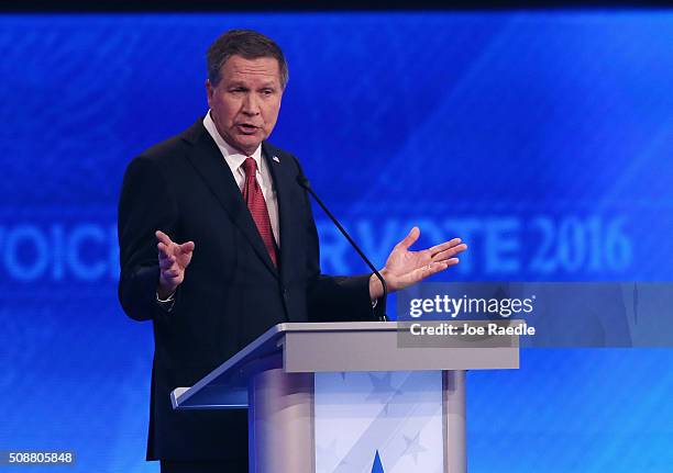 Republican presidential candidate Ohio Governor John Kasich participates in the Republican presidential debate at St. Anselm College February 6, 2016...