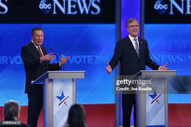 Republican presidential candidates Ohio Governor John Kasich and Jeb Bush participate in the Republican presidential debate at St. Anselm College...