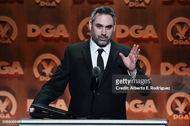 Director Alex Garland accepts the award for Outstanding Directorial Achievement of a First-Time Feature Film Director for "Ex Machina" onstage at the...