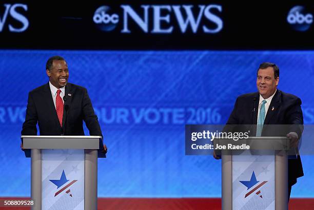 Republican presidential candidates Ben Carson and New Jersey Governor Chris Christie participate in the Republican presidential debate at St. Anselm...