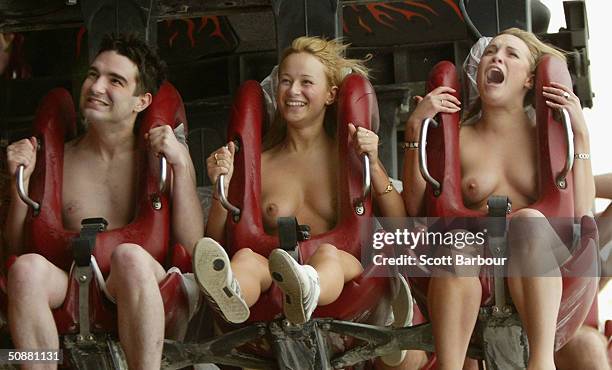 Naked students ride a rollercoaster at Thorpe Park on May 21, 2004 in Surrey, England. They broke the World record for the most amount of naked...