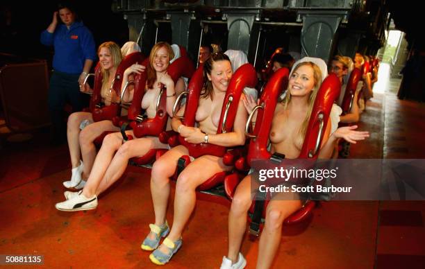 Naked students ride a rollercoaster at Thorpe Park on May 21, 2004 in Surrey, England. They broke the World record for the most amount of naked...