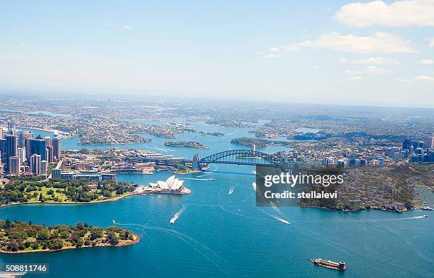 aerial view of sydney harbor and downtown - sydney aerial stock pictures, royalty-free photos & images