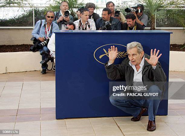 Egyptian director Youssef Chahine poses during a photo call for his film "Alexandria...New York", 21 May 2004, at the 57th Cannes Film Festival in...