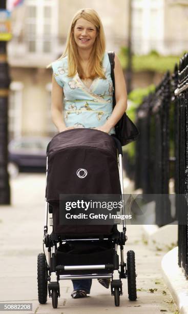 Gwyneth Paltrow takes her baby daughter, called Apple, out for a walk, on May 20, 2004 in South London.