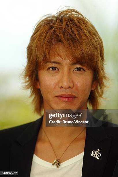 Actor Takuya Kimura attends "2046" photocall at Le Palais de Festival at the 57th Cannes Film Festival on May 21, 2004 in Cannes, France.