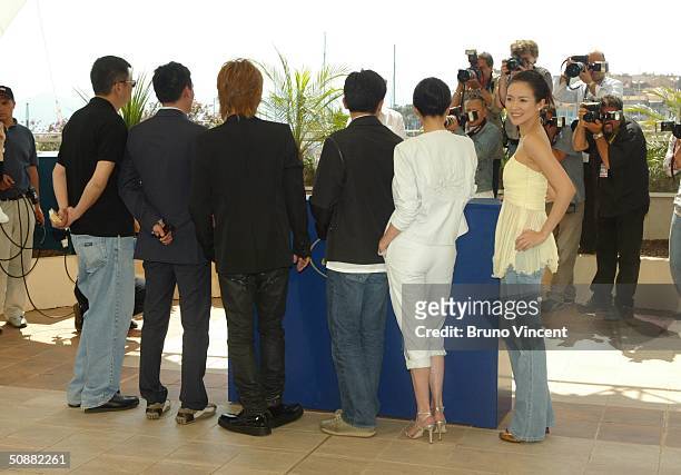 To R Director Wong Kar-Wai and actors Chang Chen, Takuya Kimura, Tony Leung, Carina Lau and Zhang Ziyi attend "2046" photocall at Le Palais de...
