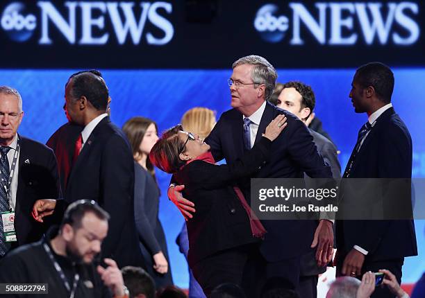 Republican presidential candidate Jeb Bush embraces his wife Columba at the conclusion of the Republican presidential debate at St. Anselm College...