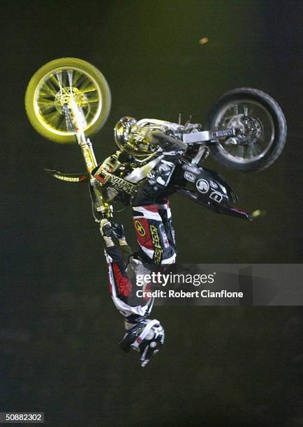 Matt Shubring flips his bike during the Crusty Demons Nine Lives Tour at the Rod Laver Arena, May 21, 2004 in Melbourne, Australia.