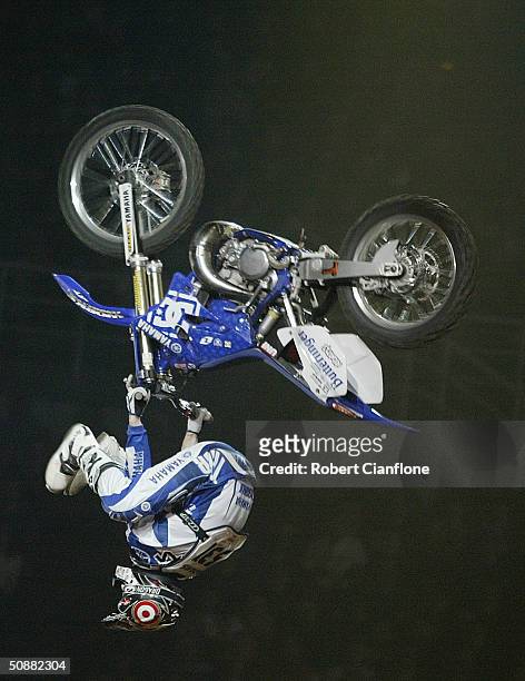 Nate Adams performs an upside down heel front heel kicker during the Crusty Demons Nine Lives Tour at the Rod Laver Arena, May 21, 2004 in Melbourne,...